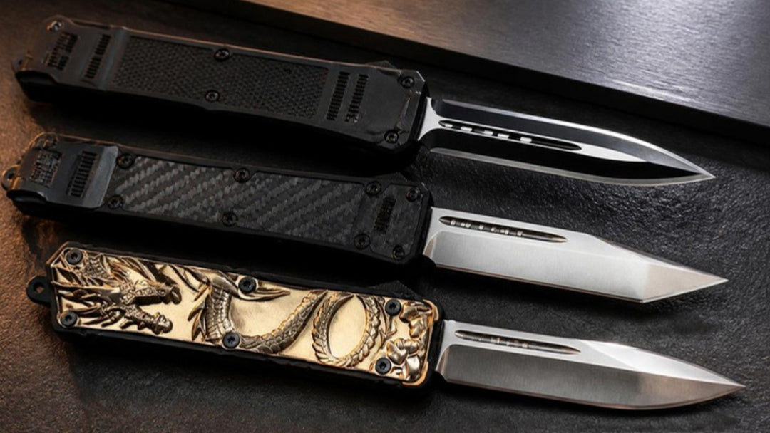 Three OTF automatic knives side by side showing a two-tone dagger blade, a tanto blade and a drop point blade